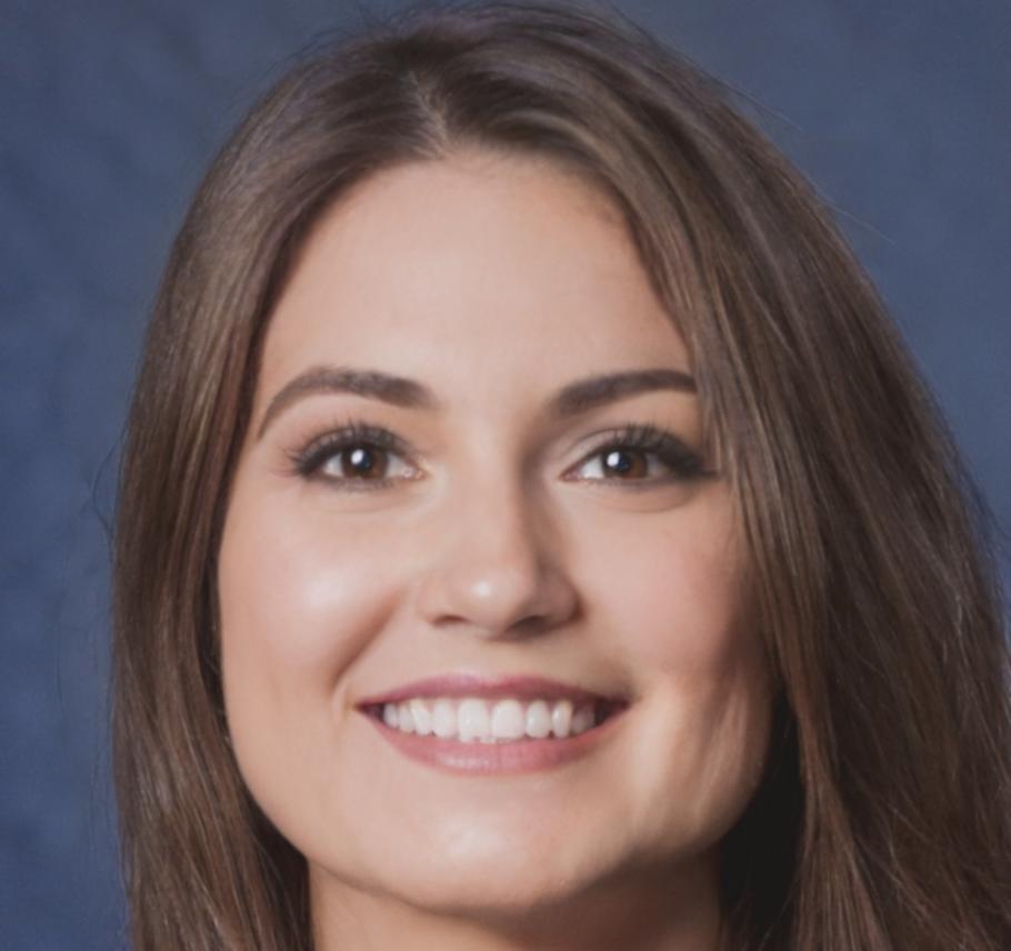 Financial analyst Dr. Katelyn Thornfield reviewing investment research